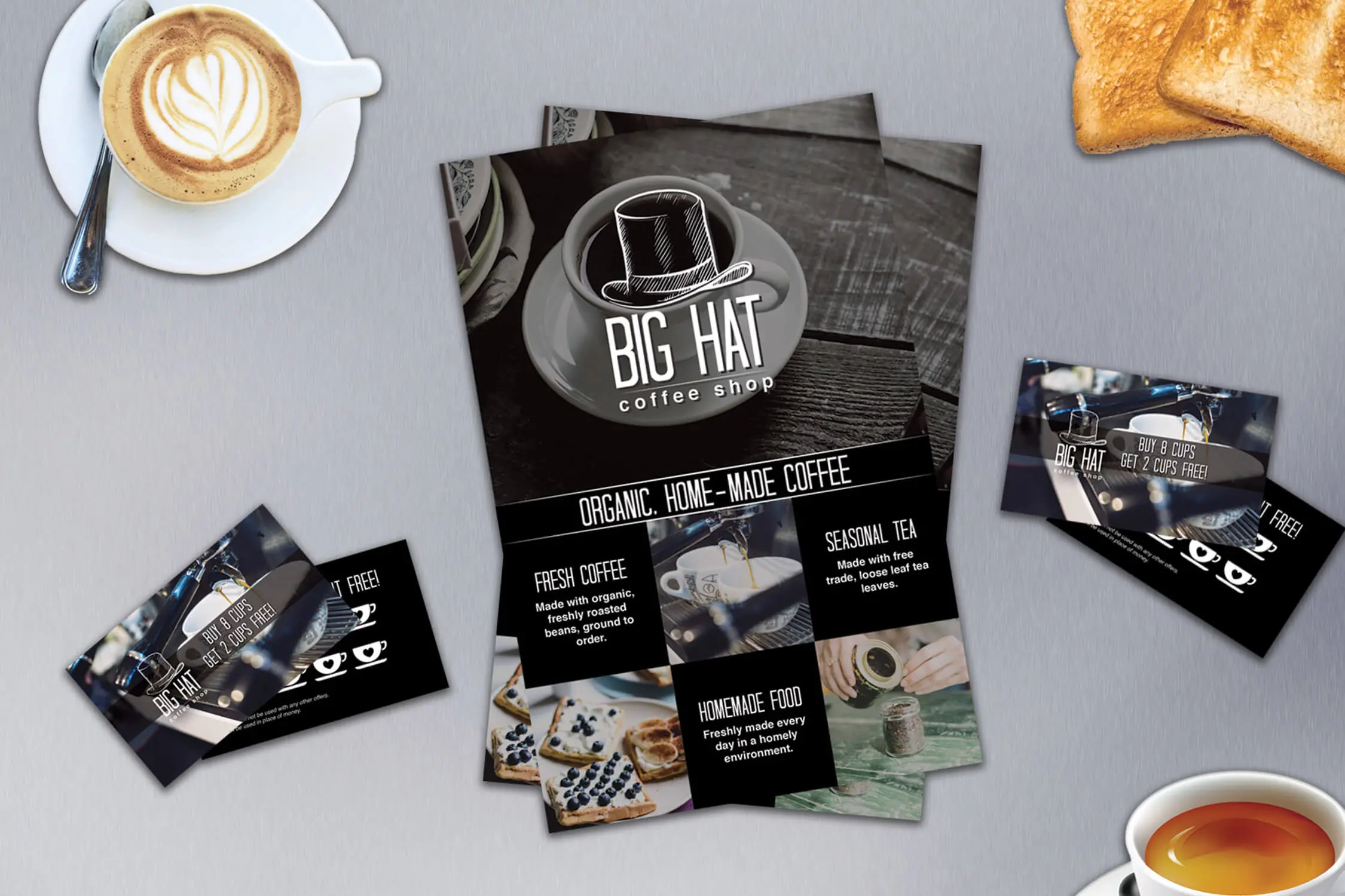 big hat coffee shop flyers and punch cards with coffee and toast on a table